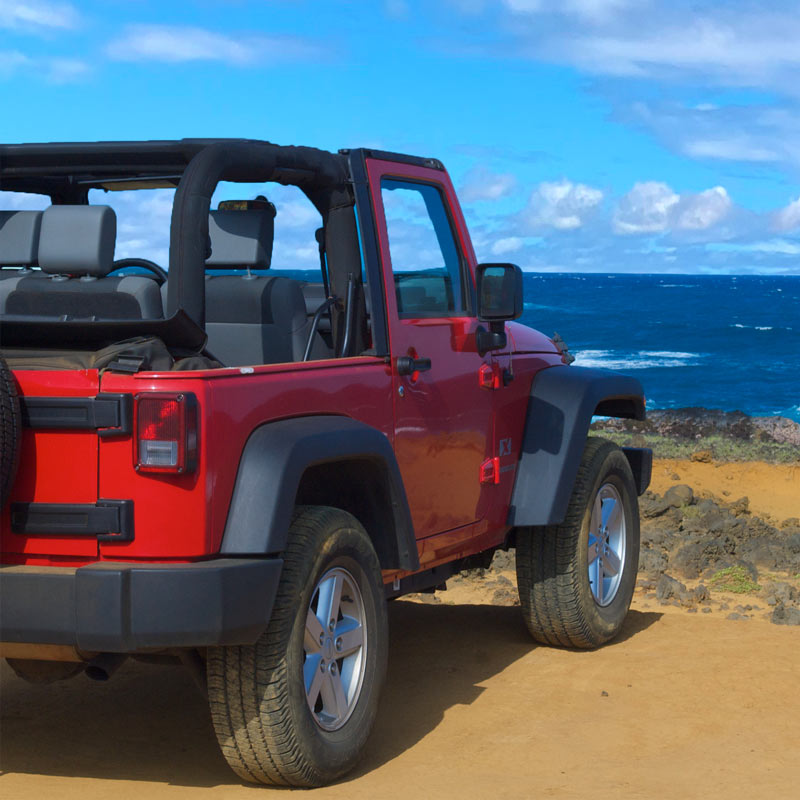 The owners Jeep on a beach on Hawaii Island