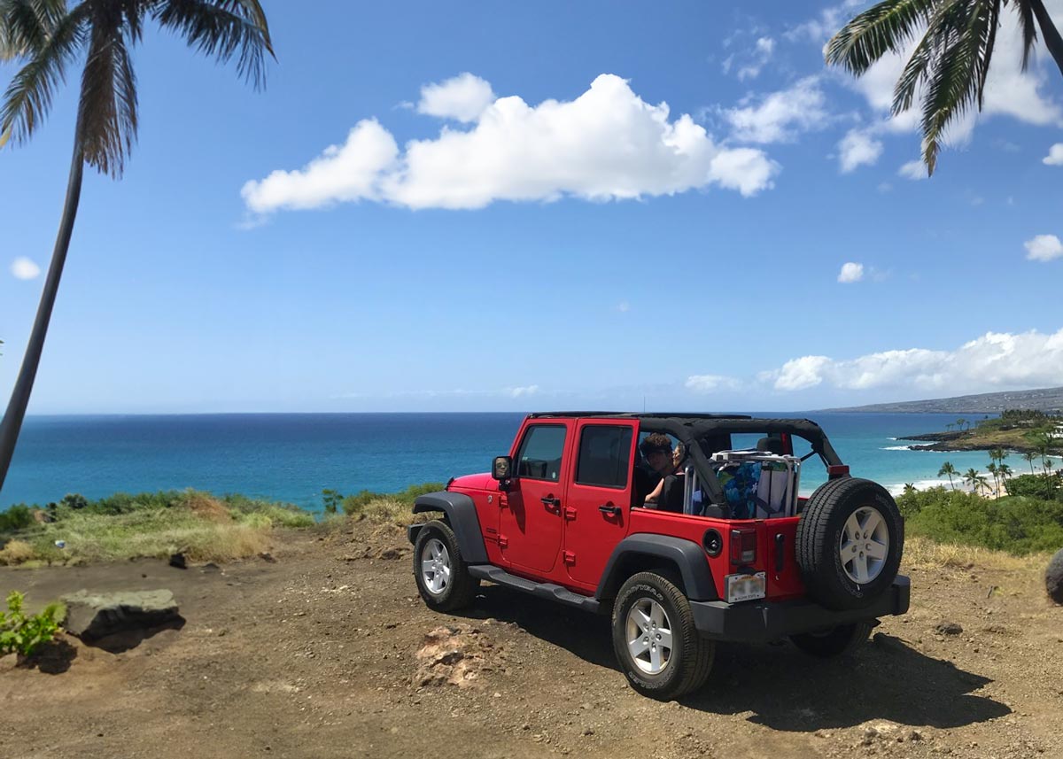 Red Jeep parked on an overlook on Maui, Hawaii